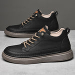 Side View of a Pair of Callan Black Elevator Sneakers | Levante Shoes