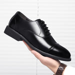 Man Holding Savant Black Leather Elevator Shoes | Levante Shoes