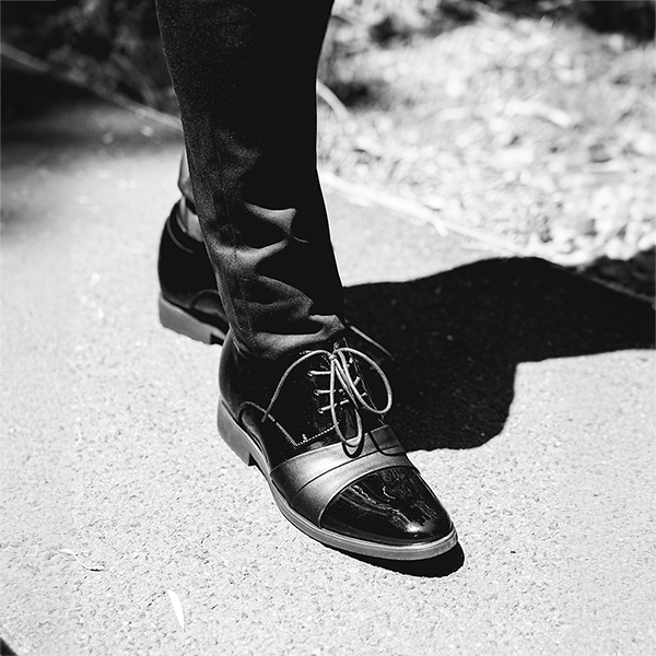 Black and White Photo of Man Walking in Ashford Elevator Shoes | Levante Shoes
