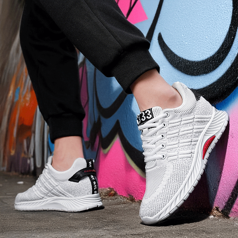 Lifestyle Image of Man Wearing Avaris White Elevator Sneakers | Levante Shoes