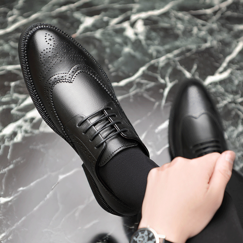 Top View of Man Sitting Cross Legged Wearing Benedikt Black Elevator Brogues | Levante Shoes