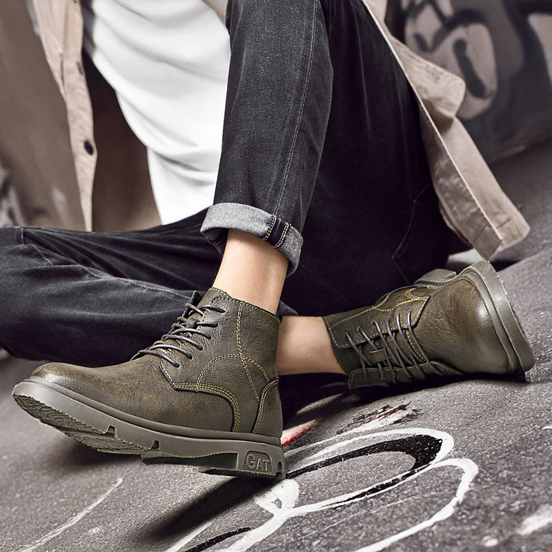 Man Sitting on Ground in Exavo Elevator Boots in Khaki | Levante Shoes
