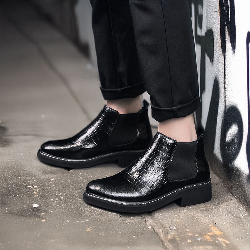 Man Standing Next to Wall in Jaxen Black Leather Elevator Boots | Levante Shoes