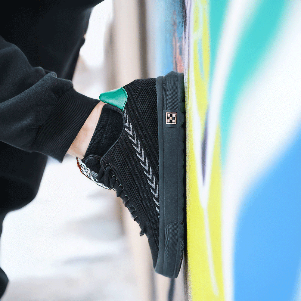 Mod Black Elevator Sneaker Against Graffiti'd Wall | Levante Shoes