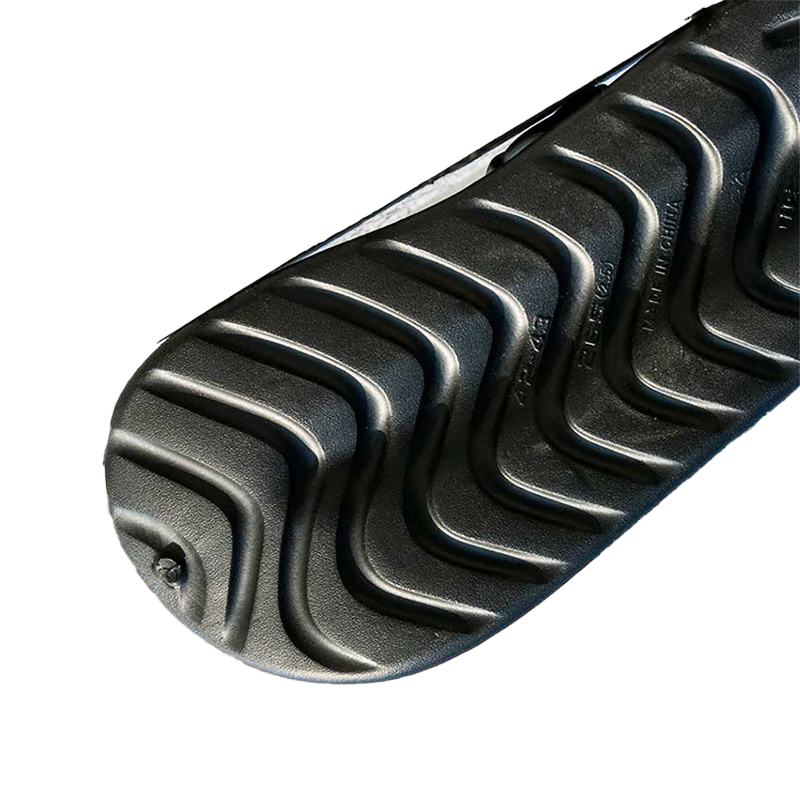 Close-up of a black rubber track with tread pattern on a transparent background