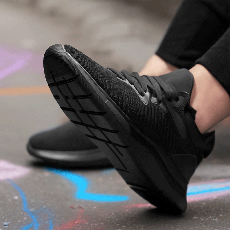 Man Sitting Down Wearing Plexa Elevator Sneakers | Levante Shoes