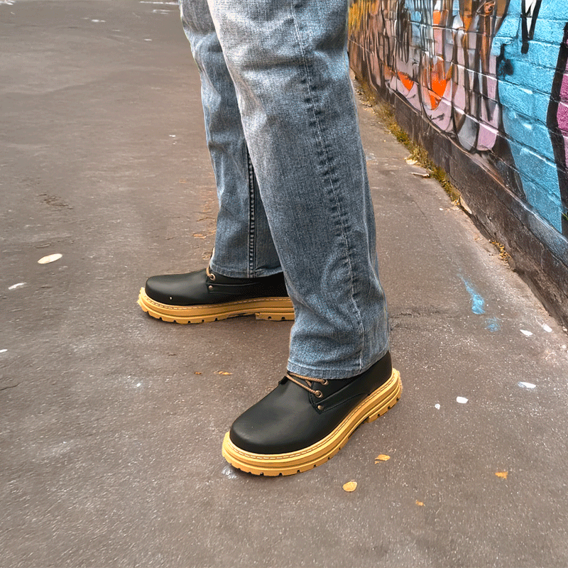 Man Standing in Alley in Rockie Black Elevator Boots | Levante Shoes
