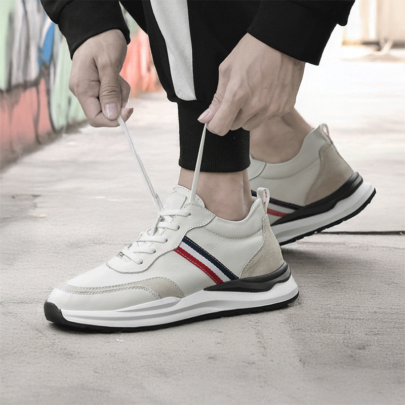 Man in Alle Tying Up Sorello Elevator Sneakers | Levante Shoes