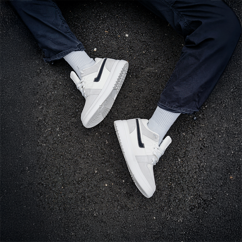 Man Sitting on Asphalt in Verve Elevator Sneakers | Levante Shoes