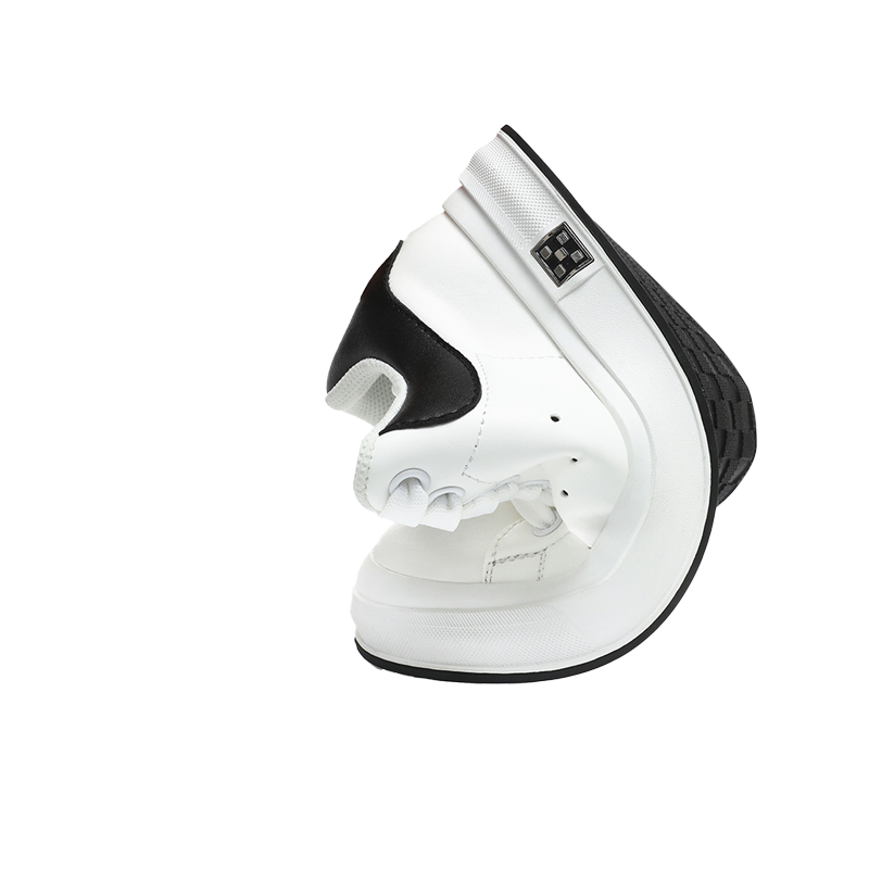 A twisted white sneaker with a black accent, showcasing its unique design and flexibility against a plain black background.
