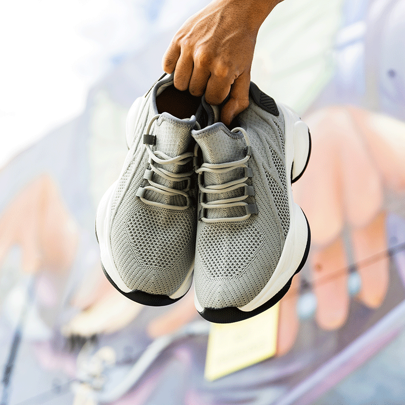 Man Holding Zenen Silver Elevator Sneakers | Levante Shoes