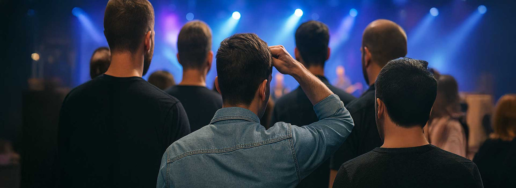 Man Standing at a Concert Unable to See