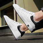 image of levante vibe sneaker wideshot with man wearing ankle cut pants