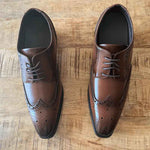 Top View of Royce Elevator Brogues in Brown on Wooden Floor | Levante Shoes