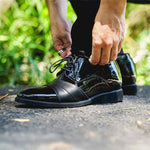 Man Leaning Down to Tie Laces on Ashford Elevator Shoes | Levante Shoes