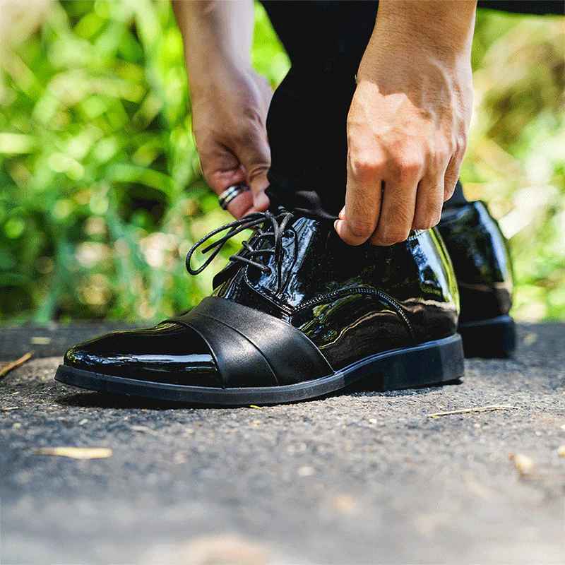 Man Leaning Down to Tie Laces on Ashford Elevator Shoes | Levante Shoes