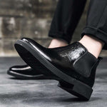Man Sitting in Mock Crocodile Elevator Boots | Levante Shoes