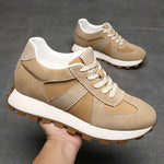 Hand holding a Camden Caramel Elevator Sneaker | Levante Shoes