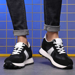 Man Standing in Black Camden Elevator Sneakers | Levante Shoes