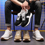 Man on Chair with Black, Caramel and Grey Camden Elevator Sneakers | Levante Shoes