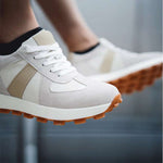 Close Up of Man Wearing Camden Elevator Sneakers Sitting on Ledge | Levante Shoes