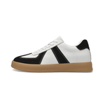 White and black sneaker with brown sole on a white background