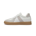 White sneaker with a brown sole on a white background