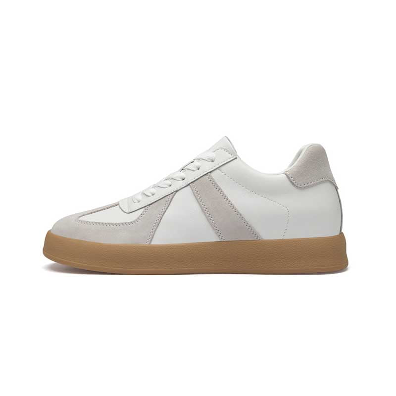 White sneaker with a brown sole on a white background