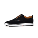 Black sneaker with brown accents on a white background