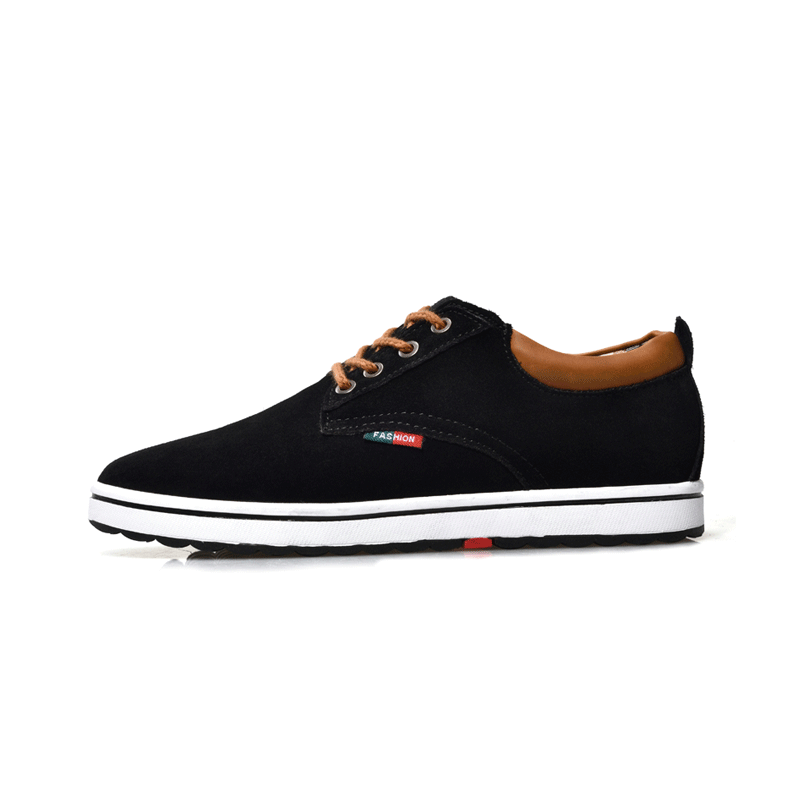 Black sneaker with brown accents on a white background