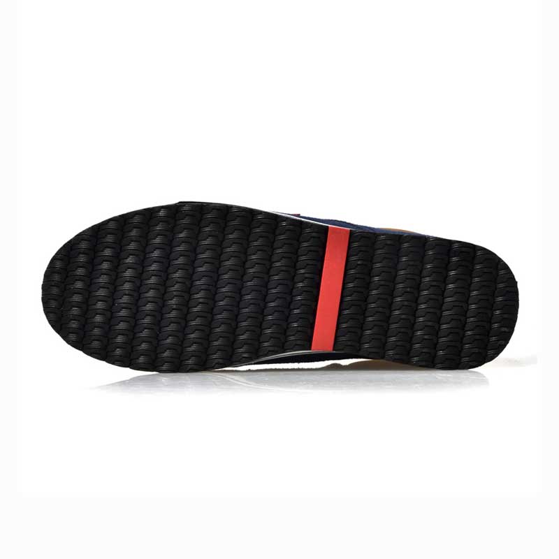 Black shoe sole with red stripe on a white background