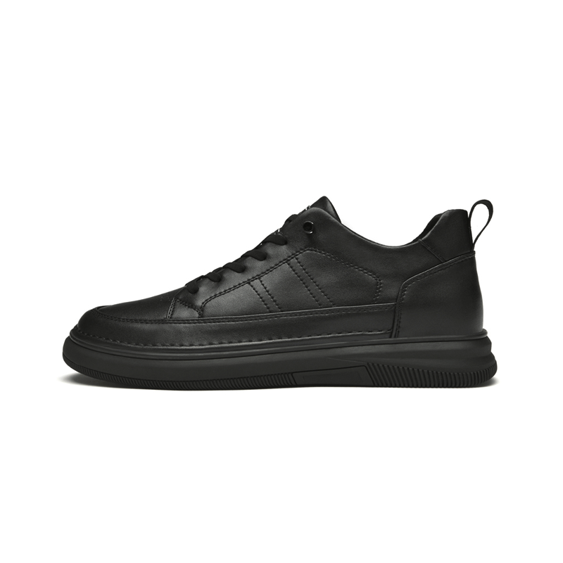 Black leather elevator sneakers on a white background
