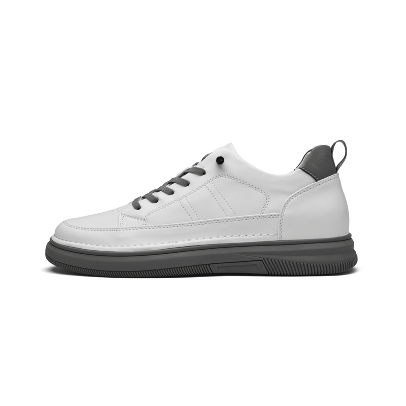 White leather elevator sneakers on white background