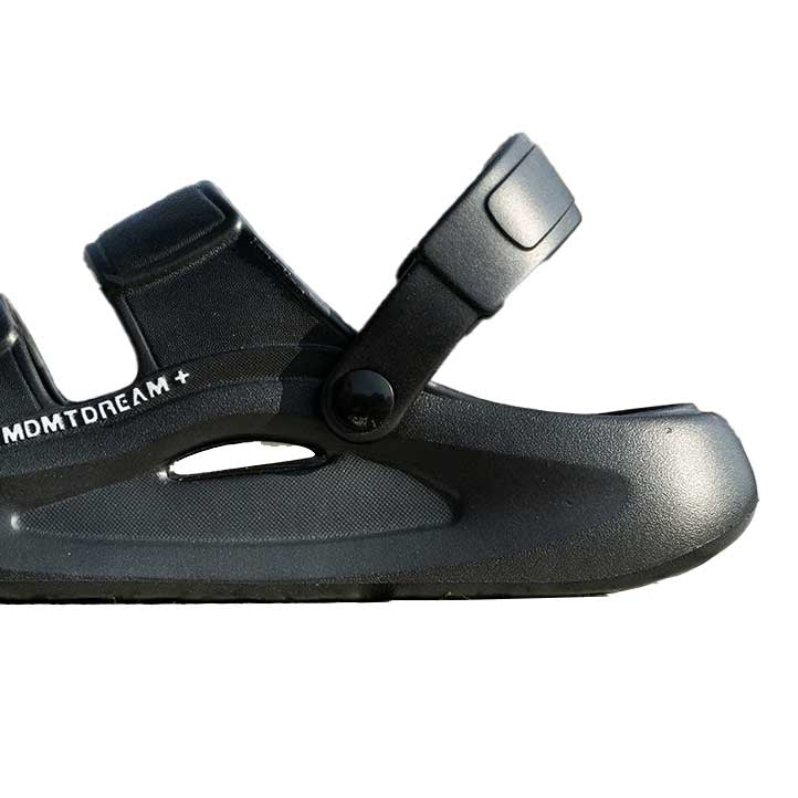Black height boosting sandal with a strap on a white background