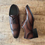 Top and Side View of Royce Elevator Brogues in Brown on Wooden Floor | Levante Shoes