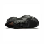 Top view of a black height boosting sneaker on a white background