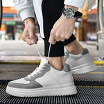 Surge height boosting sneakers in white and grey