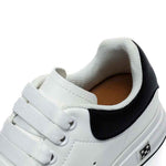Close up of white elevator sneakers