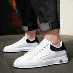 wideshot of white elevator sneakers